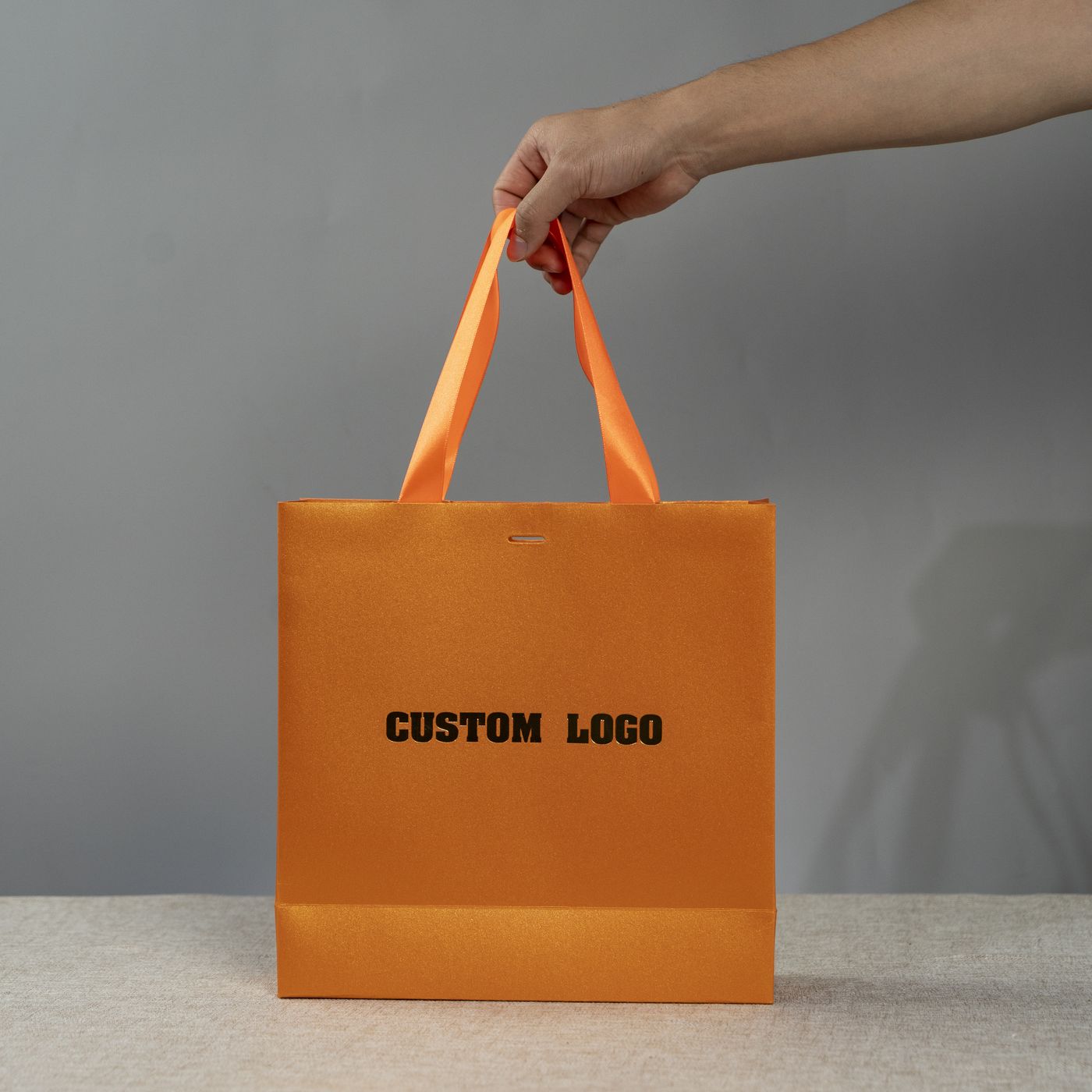 Bright orange paper bag