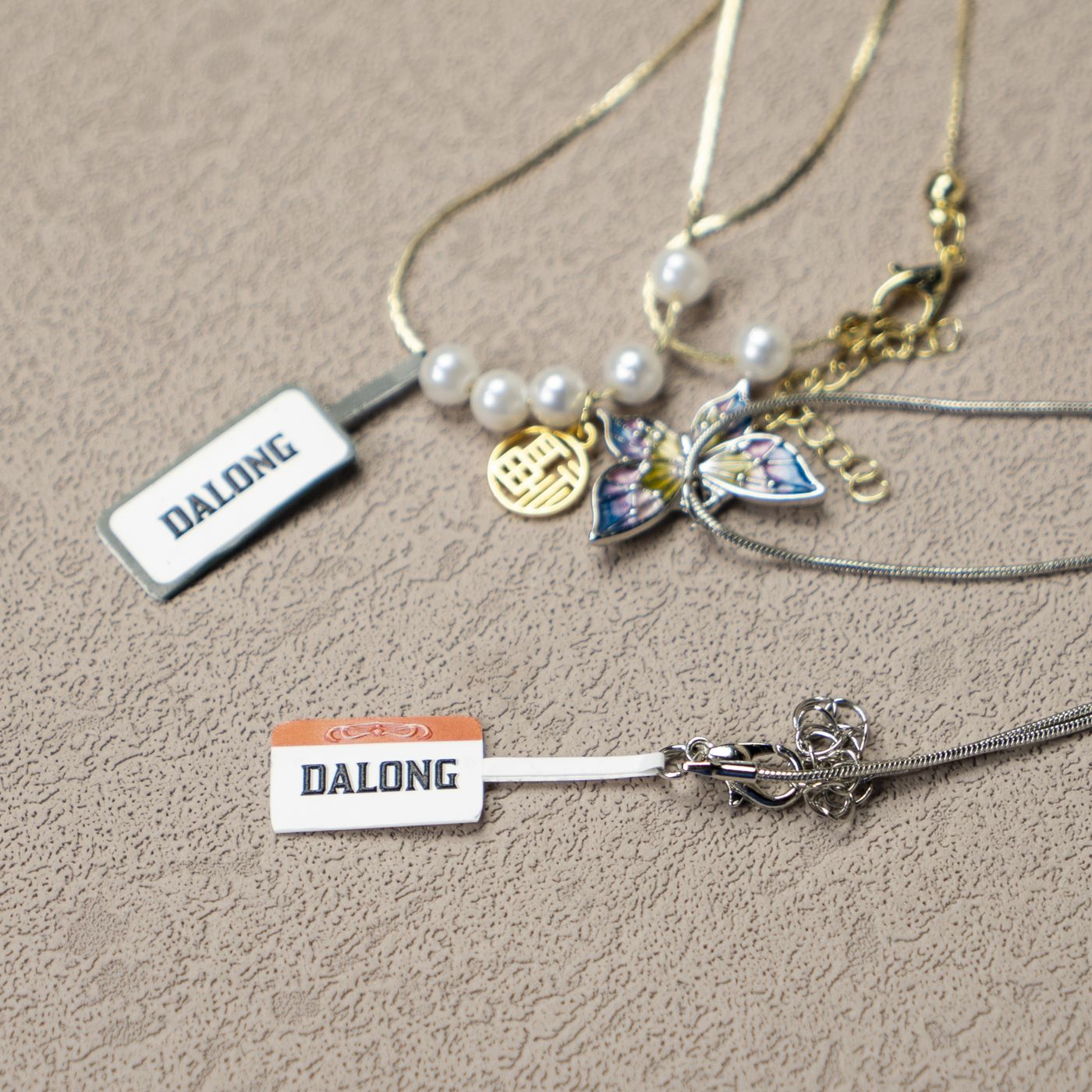 Pearl necklace brand tags